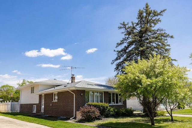 18727 Sherman St, Lansing, IL 60438 - view of front of home featuring brick siding, a chimney, and a shingled roof