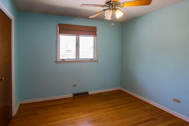 18727 Sherman St, Lansing, IL 60438 - spare room with wood finished floors, baseboards, and ceiling fan