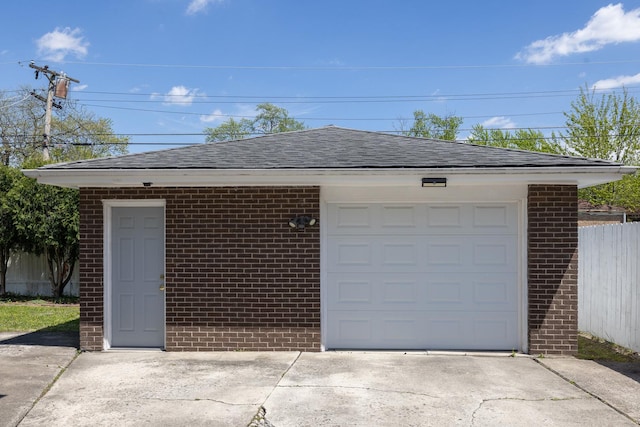 18727 Sherman St, Lansing, IL 60438 - garage featuring concrete driveway and fence