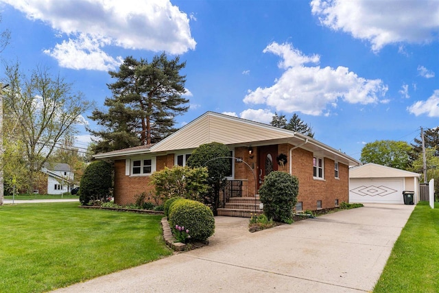 view of front of home featuring brick siding, a front lawn, a detached garage, and an outdoor structure