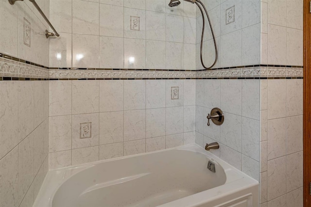 bathroom with shower / washtub combination