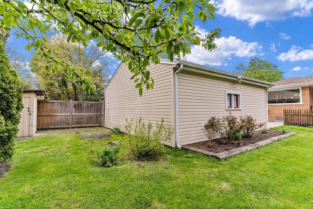 view of side of property featuring a shed and an outdoor structure