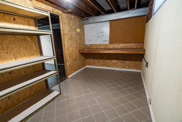 unfinished basement with tile patterned flooring