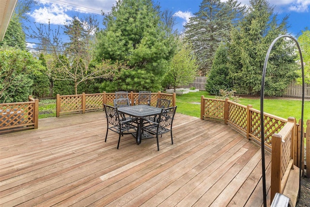 wooden terrace with outdoor dining space