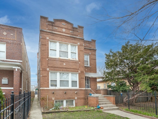 2552 N Austin Ave, Chicago, IL 60639 - view of front of property featuring brick siding and fence