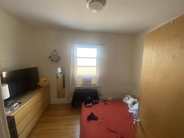 2552 N Austin Ave, Chicago, IL 60639 - bedroom with light wood-style floors and cooling unit