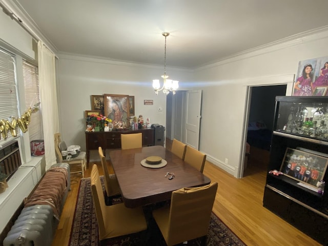 2552 N Austin Ave, Chicago, IL 60639 - dining room with a chandelier, ornamental molding, and wood finished floors
