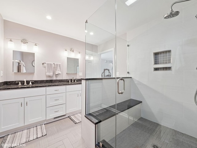 720 Ruskin Dr, Elk Grove Village, IL 60007 - bathroom featuring a stall shower, double vanity, and recessed lighting