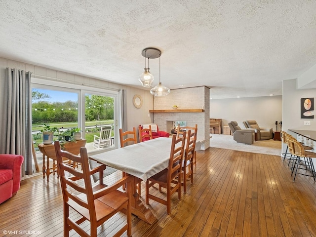 720 Ruskin Dr, Elk Grove Village, IL 60007 - dining area with a textured ceiling and hardwood / wood-style floors