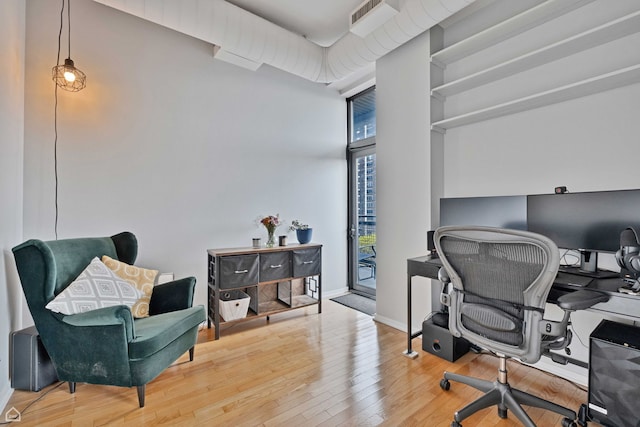 office area with wood finished floors
