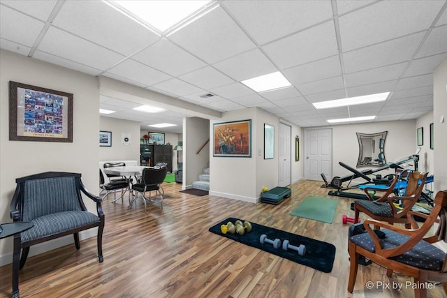 1211 Prairie Dr, Algonquin, IL 60102 - workout room with wood finished floors, a paneled ceiling, and baseboards