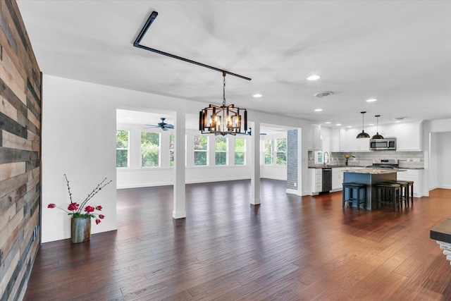811 Hamilton Dr, Champaign, IL 61820 - living area with baseboards, dark wood finished floors, recessed lighting, a chandelier, and a ceiling fan