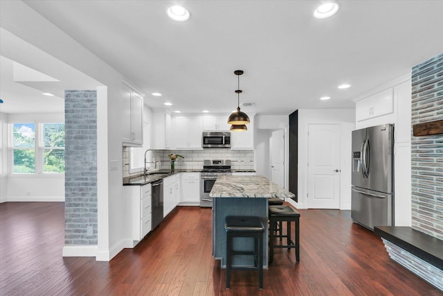 811 Hamilton Dr, Champaign, IL 61820 - kitchen with stainless steel appliances, a sink, baseboards, tasteful backsplash, and dark wood-style flooring