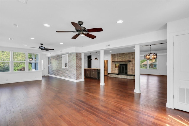 811 Hamilton Dr, Champaign, IL 61820 - unfurnished living room featuring a brick fireplace, baseboards, a ceiling fan, dark wood-type flooring, and recessed lighting