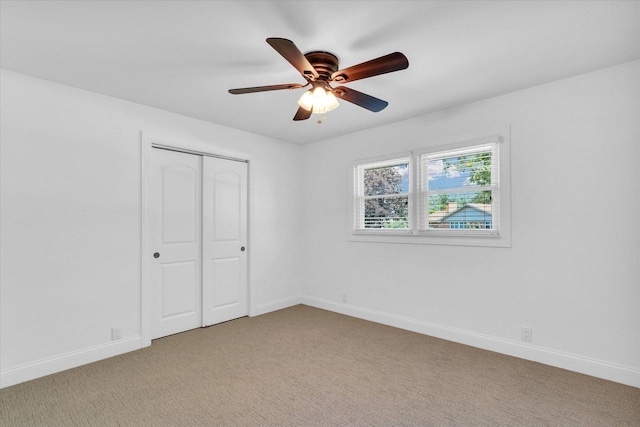 811 Hamilton Dr, Champaign, IL 61820 - unfurnished bedroom with light carpet, a closet, baseboards, and a ceiling fan