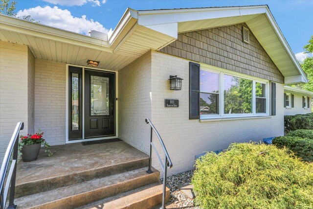 811 Hamilton Dr, Champaign, IL 61820 - doorway to property featuring brick siding