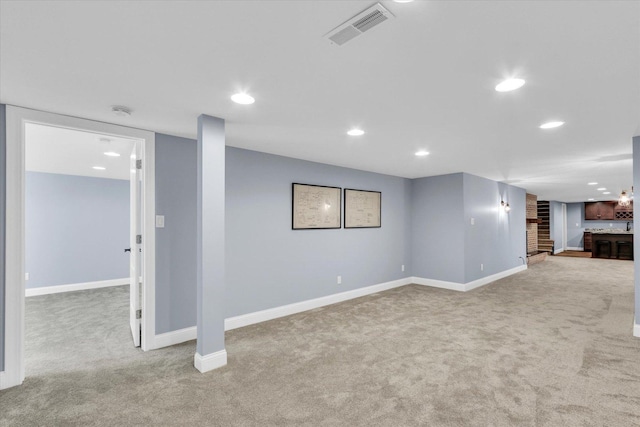 811 Hamilton Dr, Champaign, IL 61820 - finished below grade area featuring carpet floors, baseboards, recessed lighting, and bar area