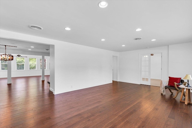 811 Hamilton Dr, Champaign, IL 61820 - unfurnished living room featuring dark wood finished floors, recessed lighting, baseboards, and a chandelier