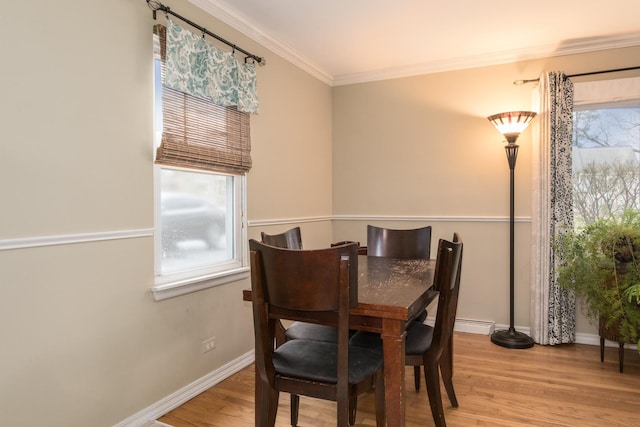 4000 Elm St, Downers Grove, IL 60515 - dining space with crown molding, wood finished floors, baseboards, and baseboard heating