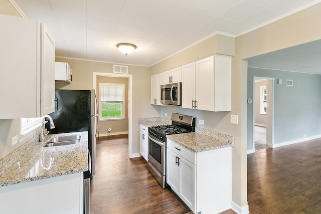 17725 Henry St, Lansing, IL 60438 - kitchen with stainless steel appliances, a sink, dark wood-type flooring, crown molding, and white cabinets