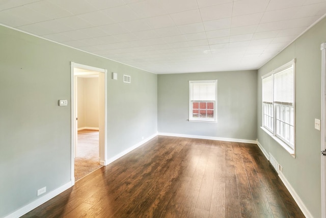 17725 Henry St, Lansing, IL 60438 - spare room featuring dark wood-style flooring and baseboards