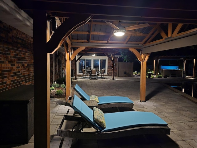 view of patio / terrace with a ceiling fan, a gazebo, and outdoor dining space