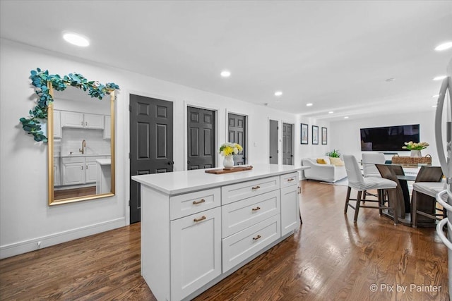 3121 Paris Ave Unit 304, River Grove, IL 60171 - kitchen with white cabinets, dark wood-style flooring, light countertops, recessed lighting, and open floor plan