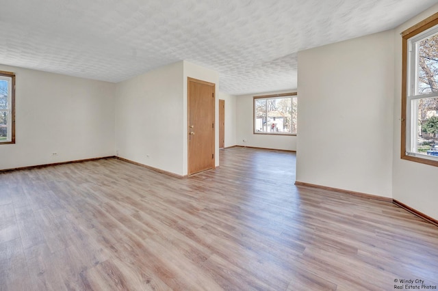 337 George Ave, Waukegan, IL 60085 - empty room featuring healthy amount of natural light and light wood-style floors