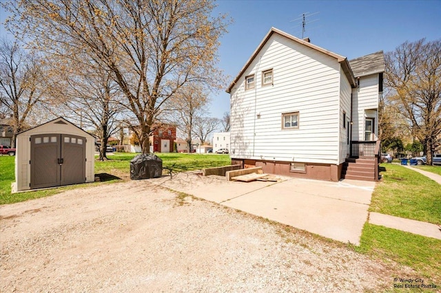 337 George Ave, Waukegan, IL 60085 - view of home's exterior featuring a storage unit, an outbuilding, and crawl space