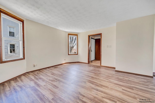 337 George Ave, Waukegan, IL 60085 - unfurnished room featuring light wood finished floors and baseboards