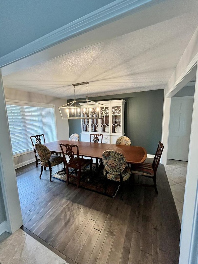 1143 N Westshore Blvd, Manteno, IL 60950 - dining room with light wood finished floors, a textured ceiling, and baseboards