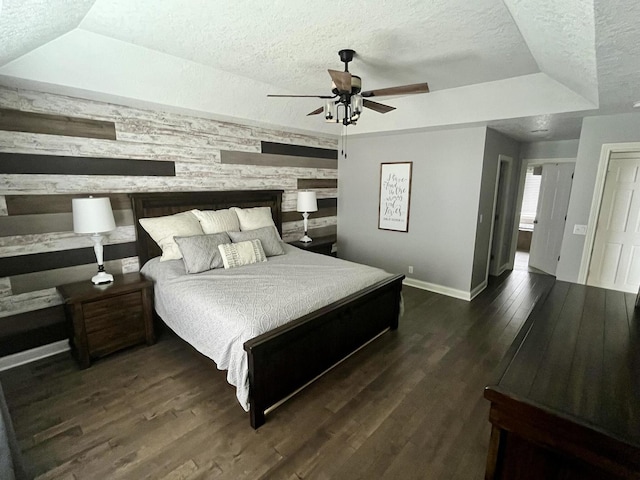 1143 N Westshore Blvd, Manteno, IL 60950 - bedroom with a textured ceiling, baseboards, wooden walls, wood finished floors, and a ceiling fan