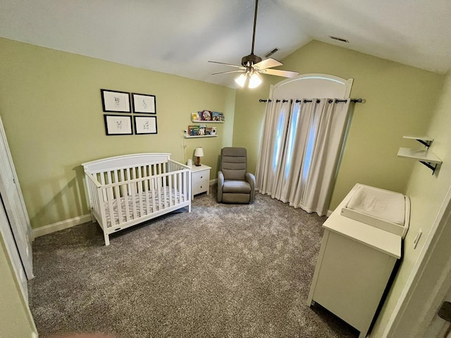 1143 N Westshore Blvd, Manteno, IL 60950 - carpeted bedroom featuring vaulted ceiling, a crib, a ceiling fan, and baseboards