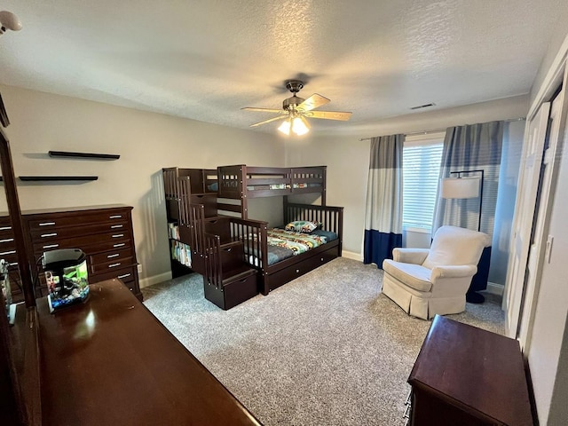1143 N Westshore Blvd, Manteno, IL 60950 - carpeted bedroom featuring baseboards, a textured ceiling, and a ceiling fan