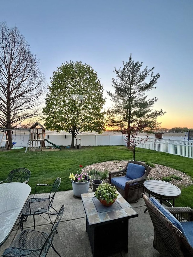 1143 N Westshore Blvd, Manteno, IL 60950 - patio terrace at dusk with a playground