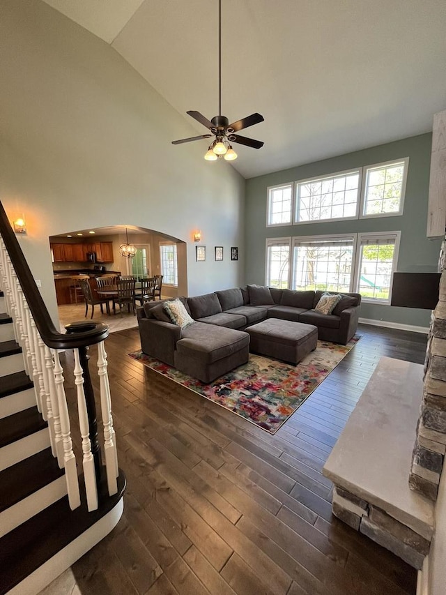 1143 N Westshore Blvd, Manteno, IL 60950 - living room featuring dark wood finished floors, high vaulted ceiling, a ceiling fan, stairway, and a chandelier