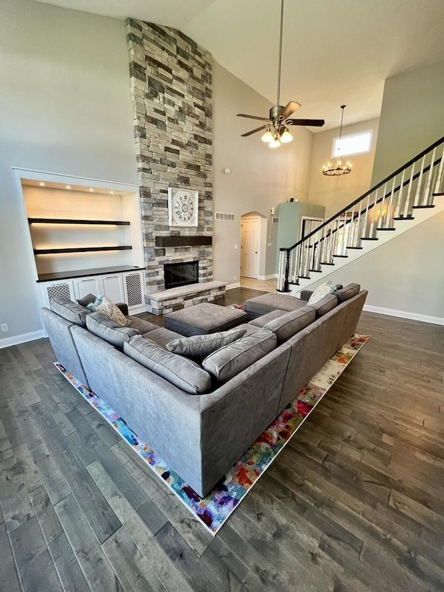 1143 N Westshore Blvd, Manteno, IL 60950 - living room featuring high vaulted ceiling, stairway, wood finished floors, a fireplace, and baseboards