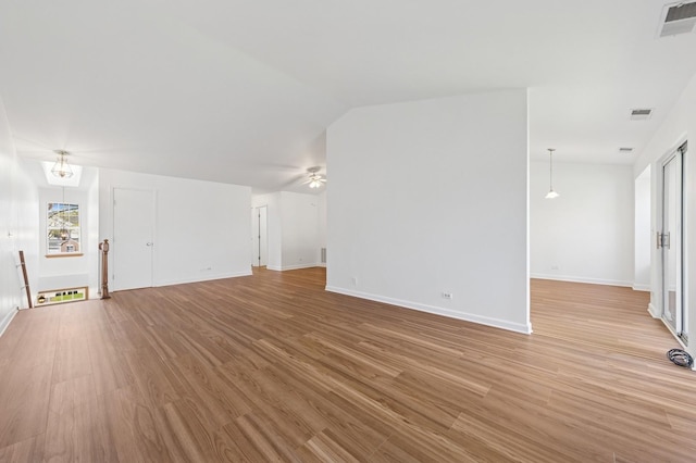 unfurnished living room with light wood-style flooring, baseboards, and a ceiling fan