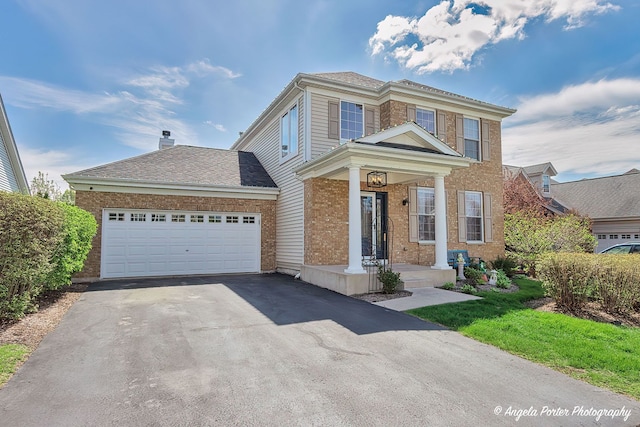 3123 Concord Ln, Wadsworth, IL 60083 - view of front of property featuring asphalt driveway, brick siding, and a garage