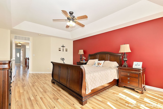 3123 Concord Ln, Wadsworth, IL 60083 - bedroom with a raised ceiling, light wood-type flooring, baseboards, and a ceiling fan