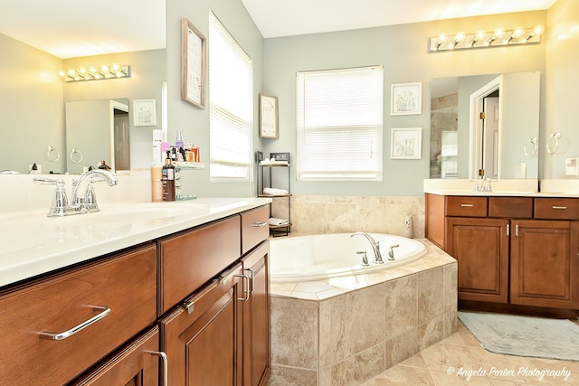 3123 Concord Ln, Wadsworth, IL 60083 - bathroom featuring two vanities, a bath, and tile patterned flooring