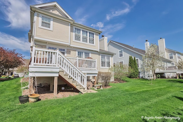 3123 Concord Ln, Wadsworth, IL 60083 - rear view of house featuring a yard, stairway, and a deck