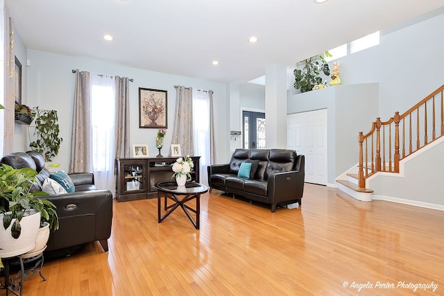 3123 Concord Ln, Wadsworth, IL 60083 - living room featuring light wood-style floors, stairway, and recessed lighting