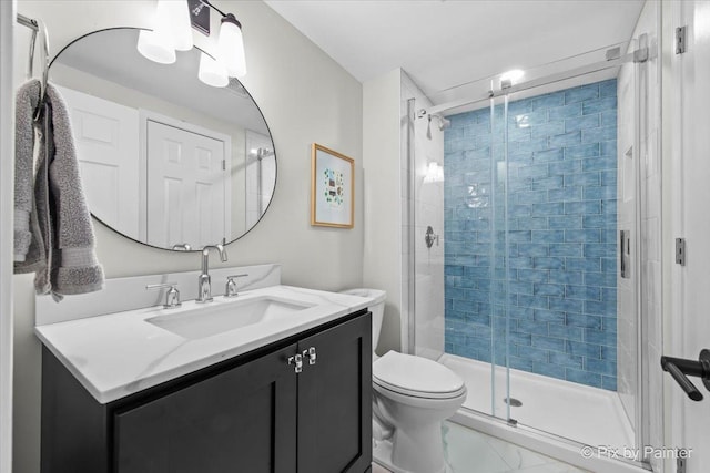 full bath with a stall shower, toilet, vanity, and marble finish flooring