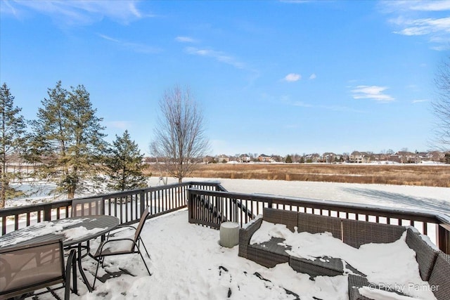 view of snow covered deck