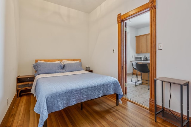 3809 N Kenmore Ave, Chicago, IL 60613 - bedroom with light wood finished floors