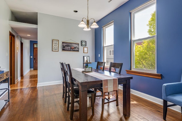 3809 N Kenmore Ave, Chicago, IL 60613 - dining area with dark wood-type flooring, a chandelier, baseboards, and recessed lighting