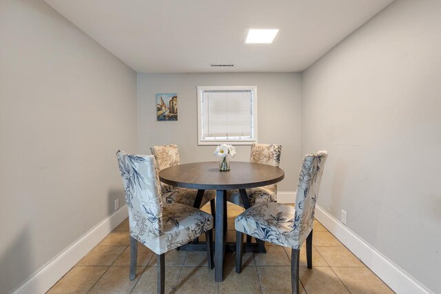 3809 N Kenmore Ave, Chicago, IL 60613 - dining area with light tile patterned floors and baseboards