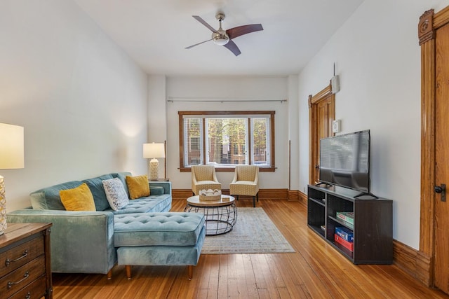 3809 N Kenmore Ave, Chicago, IL 60613 - living room featuring a ceiling fan, wood-type flooring, and baseboards