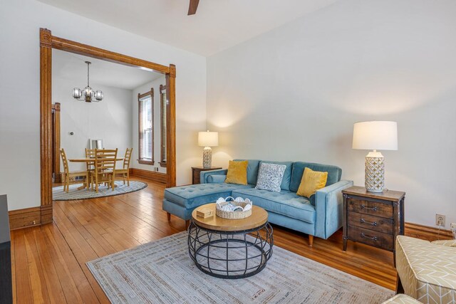 3809 N Kenmore Ave, Chicago, IL 60613 - living area with a chandelier, hardwood / wood-style flooring, and a ceiling fan